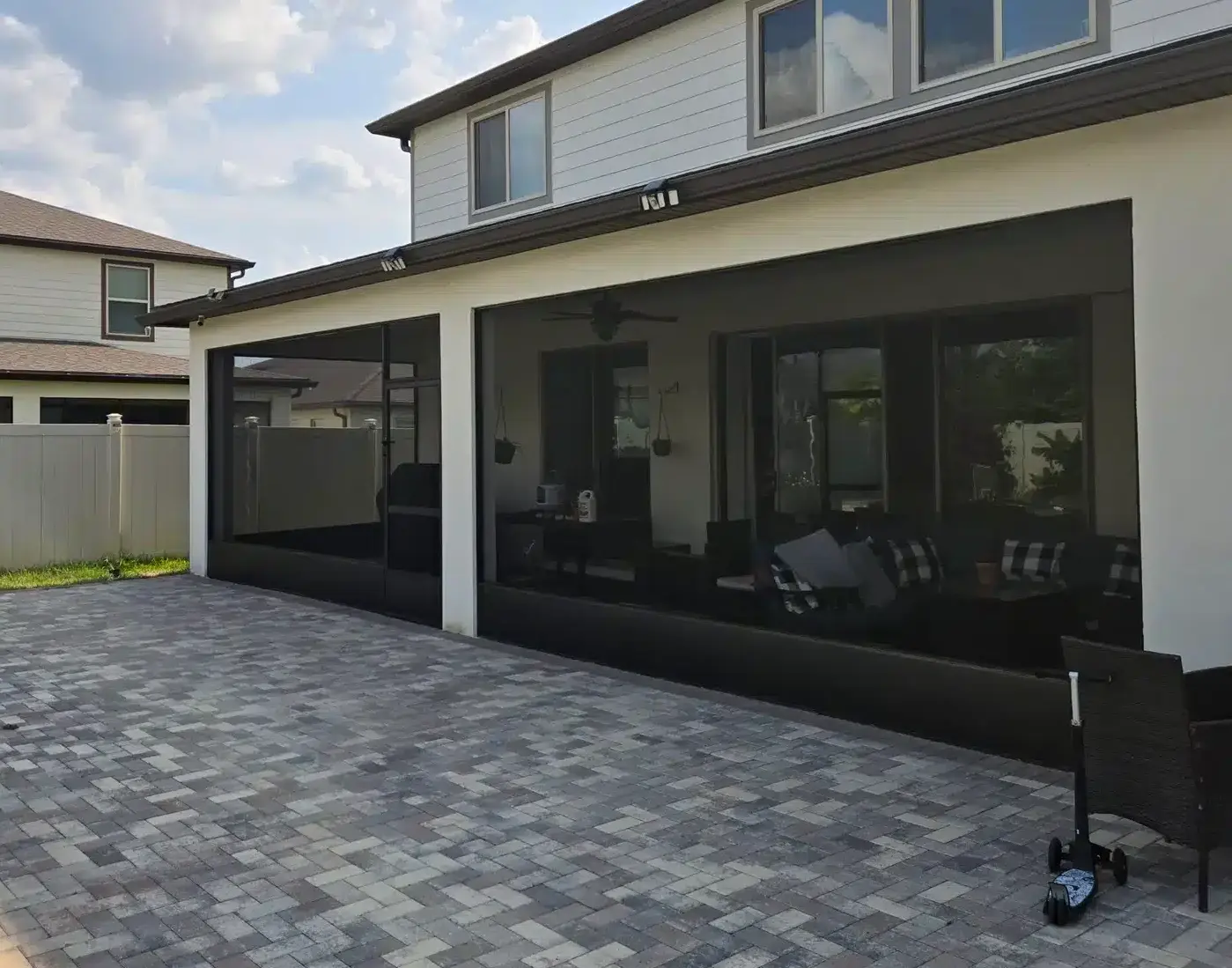Aluminum frame restoration of lanai screen near Central Florida patio."